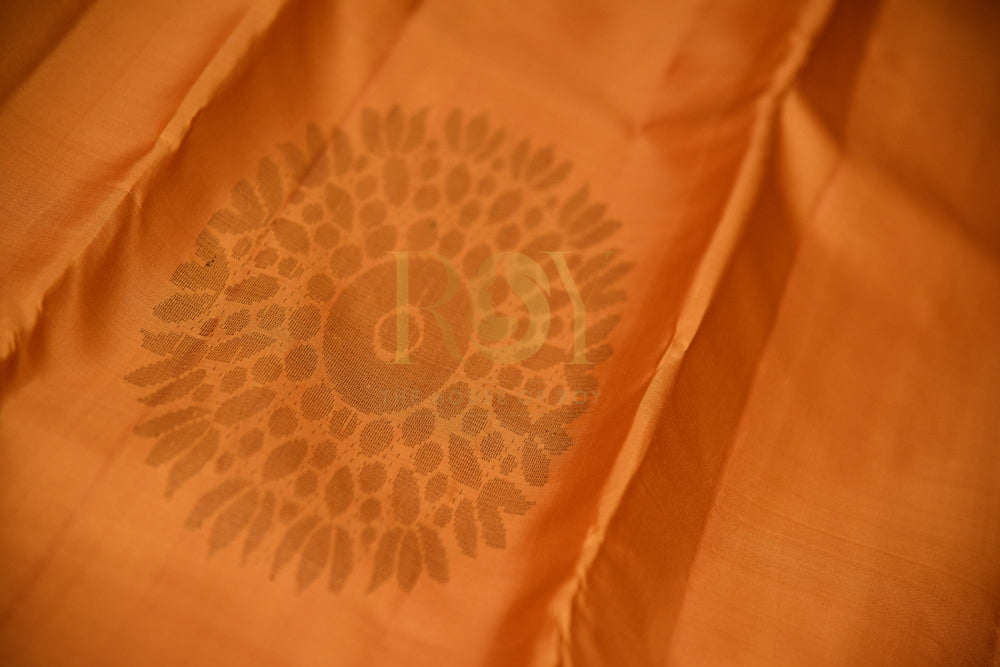 Borderless Pure Kanchipuram Silk Saree In Vibrant Orange Color With Pink & Gold Peacock Motif