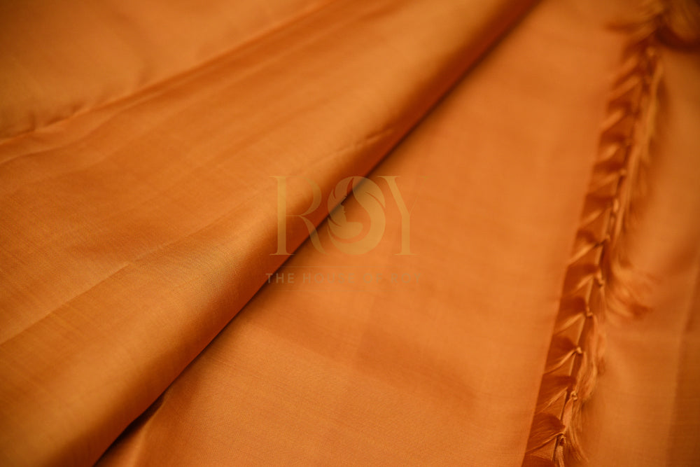 Borderless Pure Kanchipuram Silk Saree In Vibrant Orange Color With Pink & Gold Peacock Motif