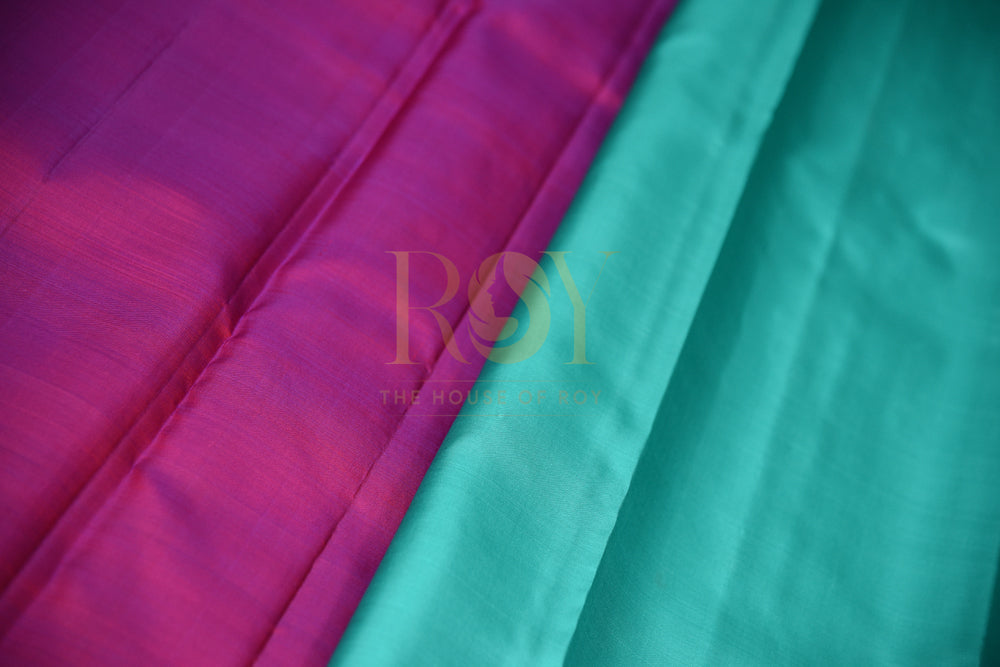 Dark Green Borderless Kanchipuram Silk Saree with Pink Zari Peacock Motif