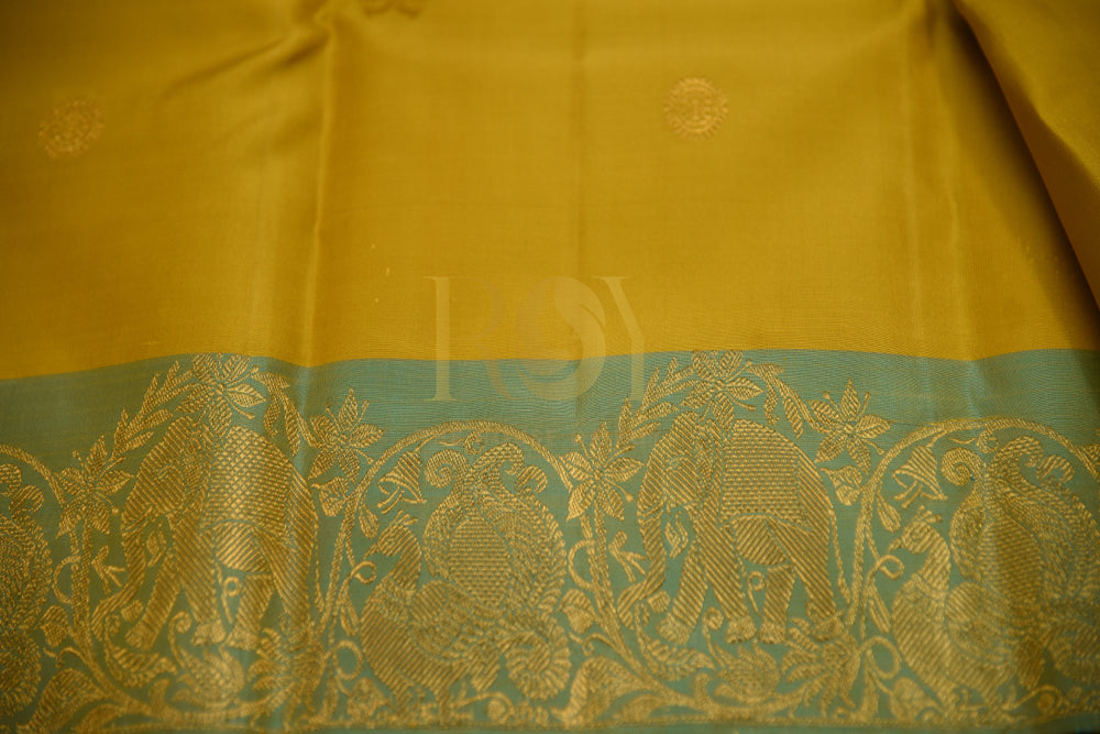 Pure Kanchipuram Silk Saree In Yellow With Golden Zari & Green Border